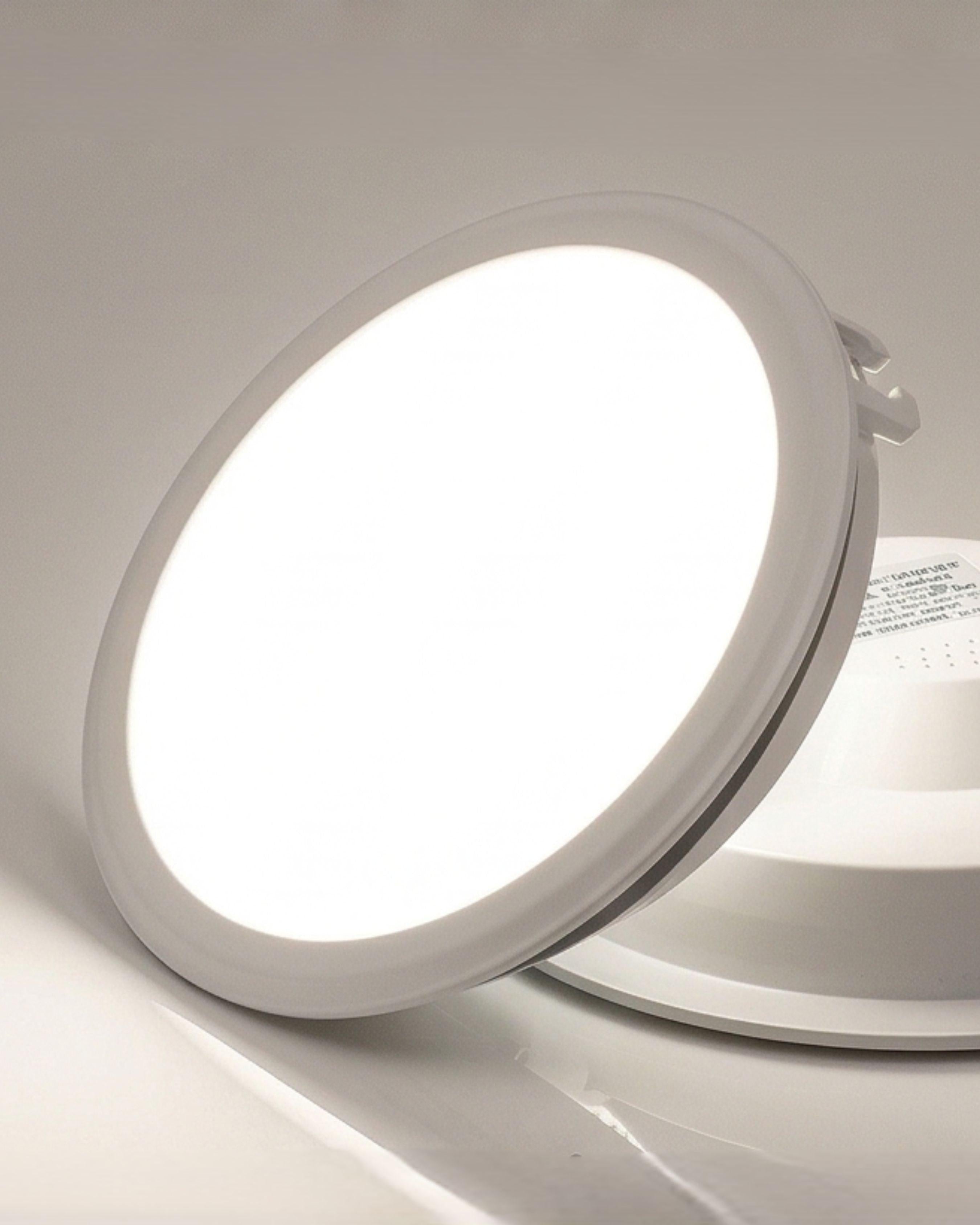 Round LED light fixture on a white background
